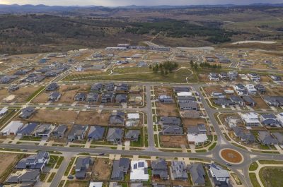 Aerial view of streets, houses and housing development in the newly established suburb of Denman Prospect in Canberra, Australia Aerial view of streets, houses and housing development in the newly established suburb of Denman Prospect in Canberra, Australia