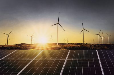 solar panels with wind turbine and sunset .concept power energy in nature solar panels with wind turbine and sunset .concept power energy in nature