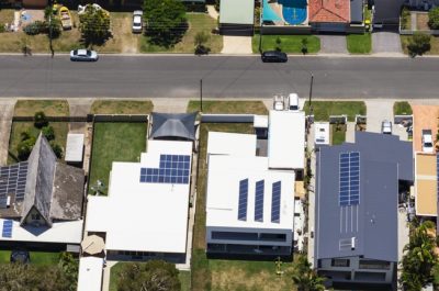 Solar panels on suburban waterfront homes