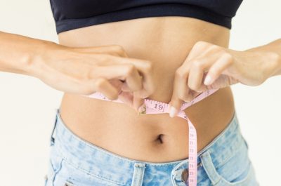 health-care-concept-fitness-slim-women-is-take-measure-on-body-with-picture-id972895996_0