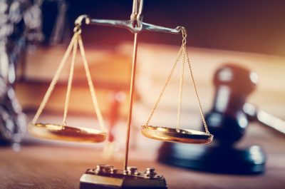 Gold measuring scales in the courtroom Gold measuring scales in the courtroom