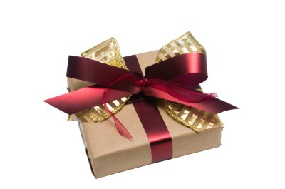 Wrapped vintage gift box with red ribbon bow