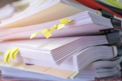 Stack of report paper documents for business desk, Business papers for Annual Report files, Document is written,presented. Business offices concept, soft focus Stack of report paper documents for business desk, Business papers for Annual Report files, Document is written,presented. Business offices concept, soft focus