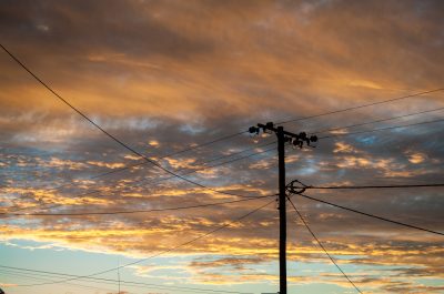 Silhouette,Of,Power,Pole,And,Power,Lines,In,Lightning,Ridge Silhouette,Of,Power,Pole,And,Power,Lines,In,Lightning,Ridge